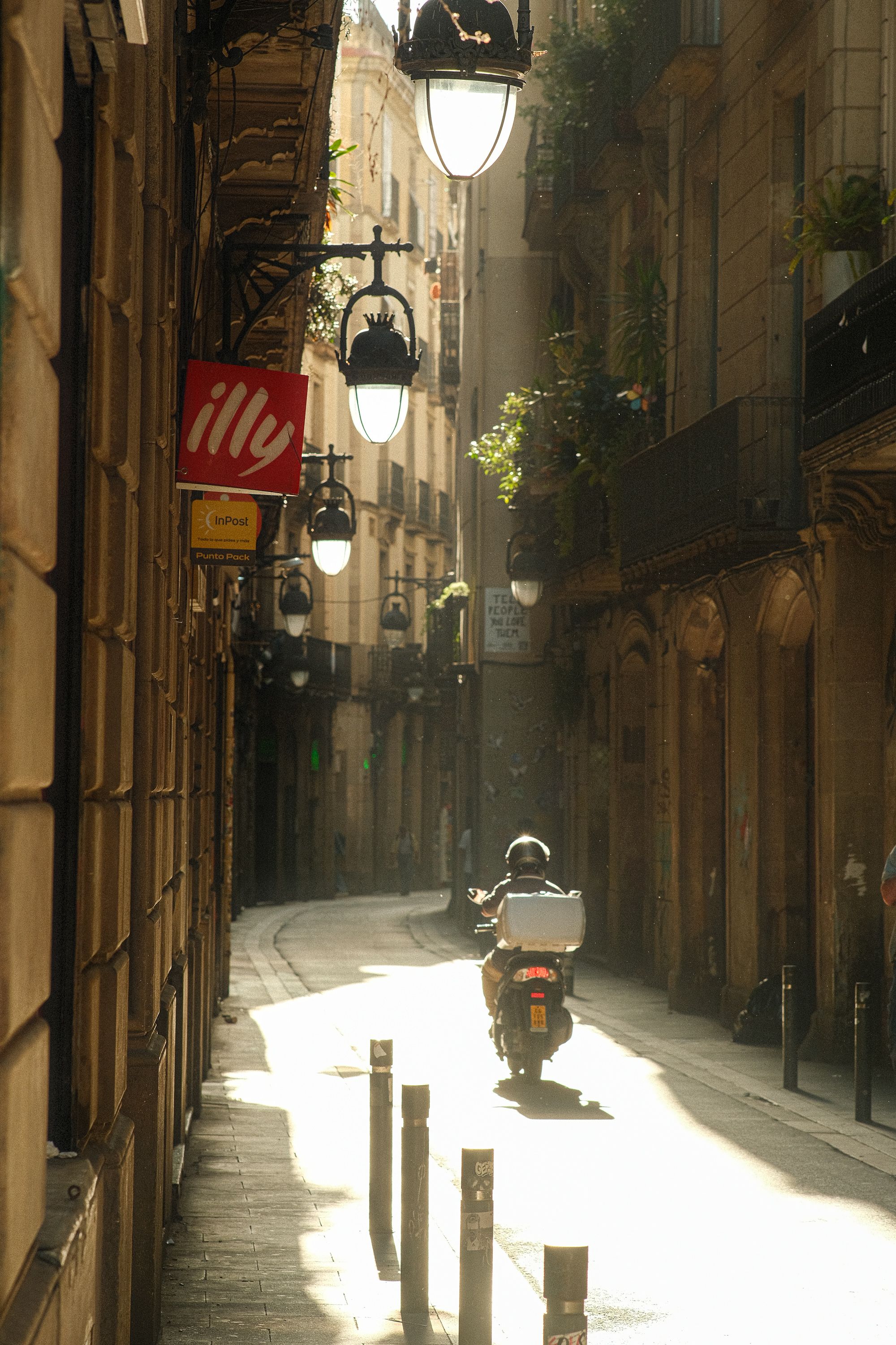 Quiet Urban Alley with Scooter Rider at Sunrise · Free Stock Photo