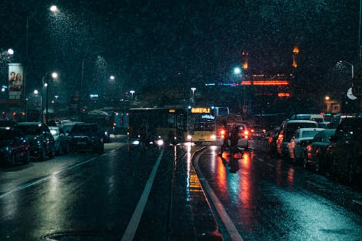 Captivating snowy night scene capturing traffic and vibrant lights in Istanbul's streets.