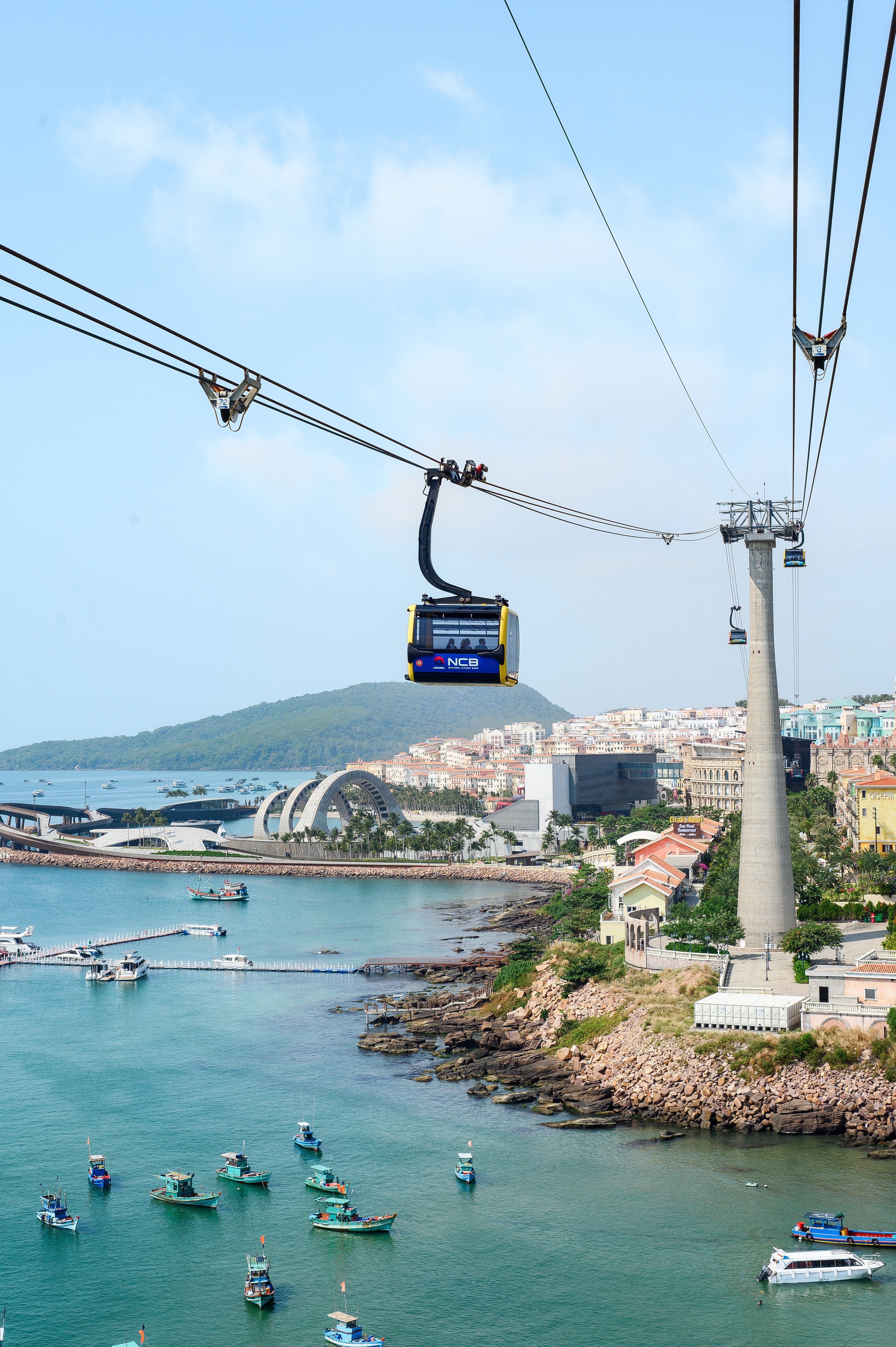 Scenic Cable Car Over Coastal City Bay · Free Stock Photo