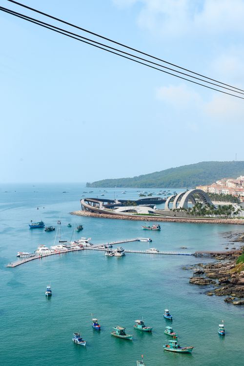 Free A picturesque harbor with boats and modern architecture on a sunny day. Stock Photo