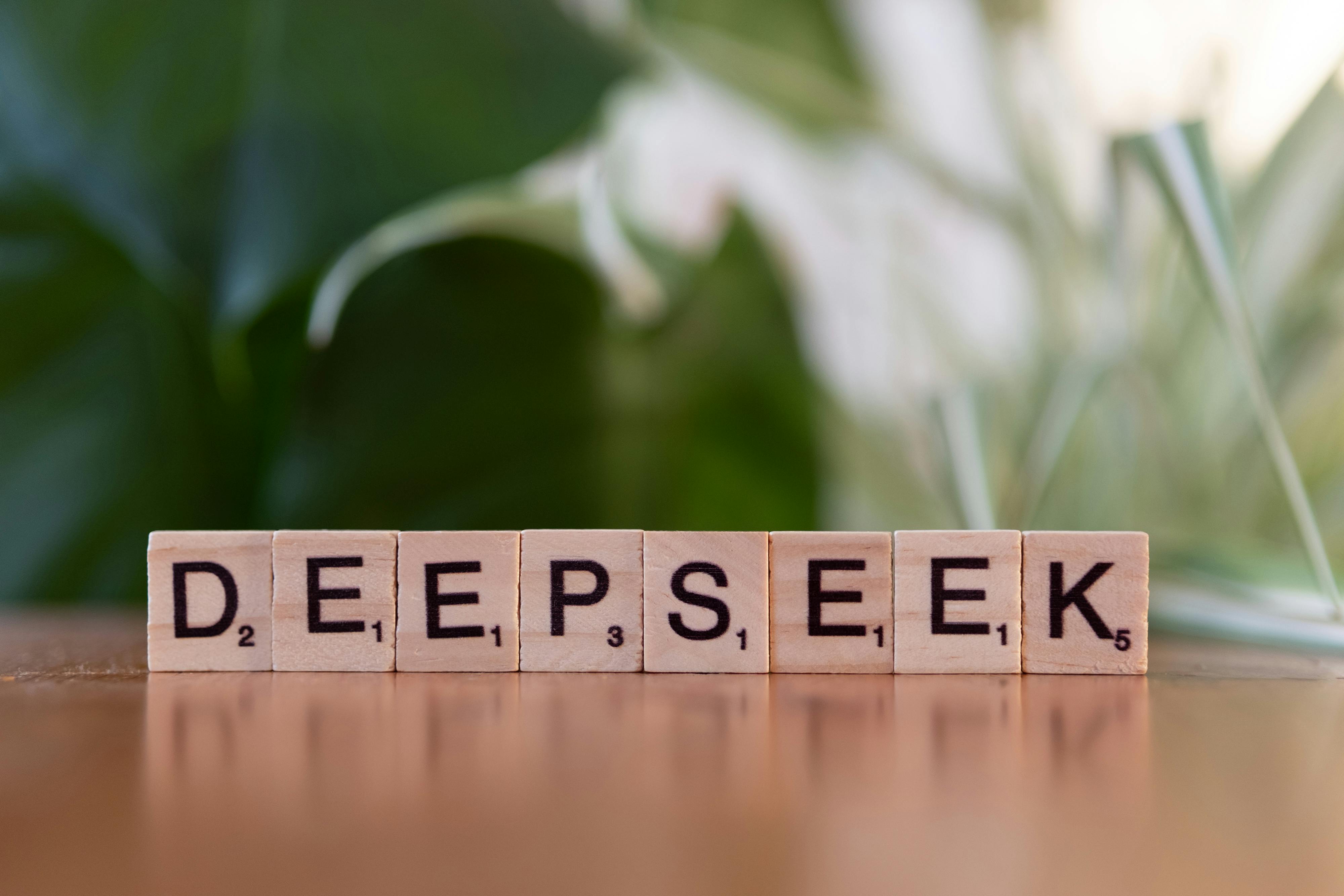 wooden tiles spelling deepseek on table