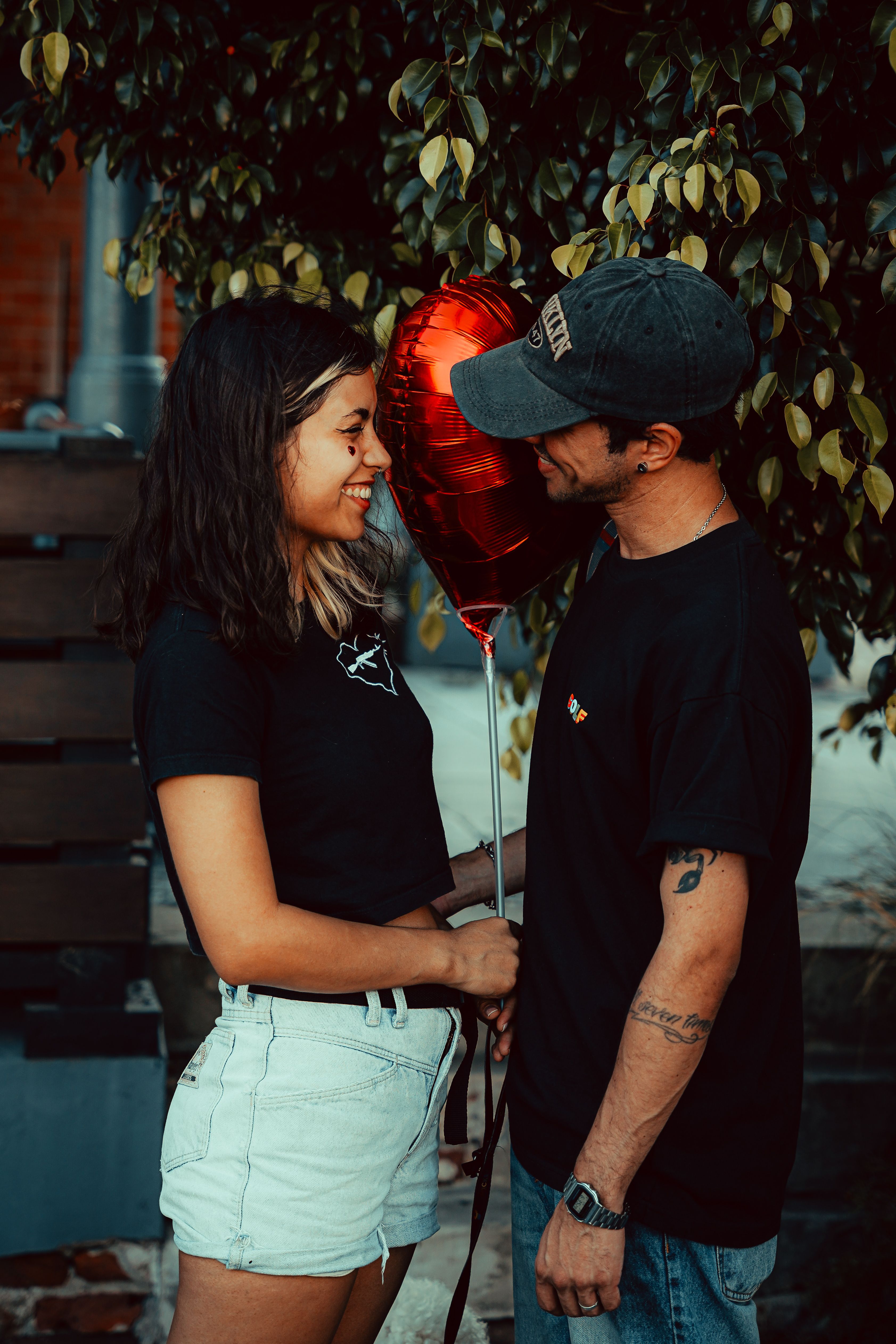 Romantic Couple with Heart Balloon Outdoors · Free Stock Photo