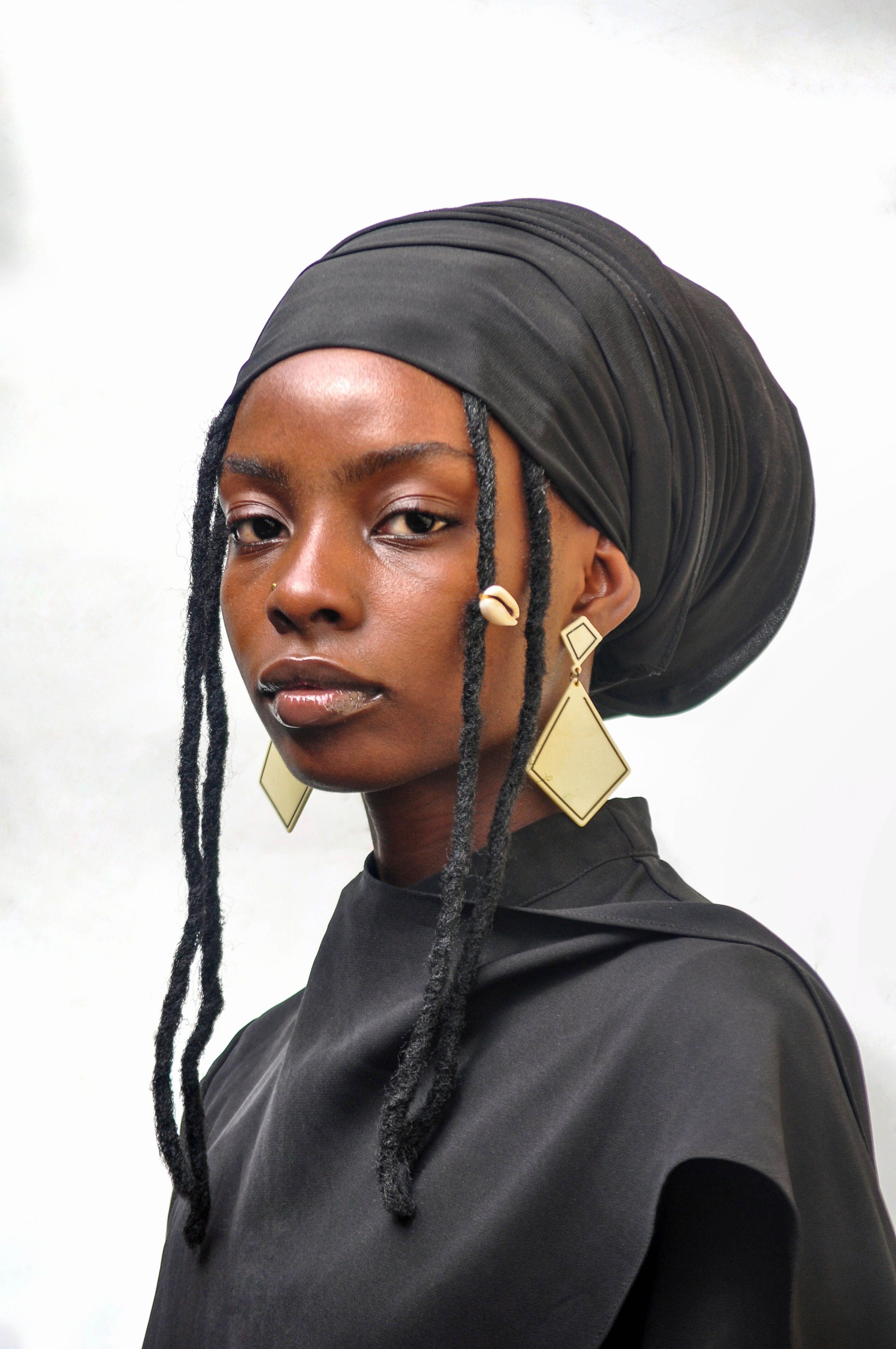 Elegant African Fashion Portrait in Black and Gold · Free Stock Photo
