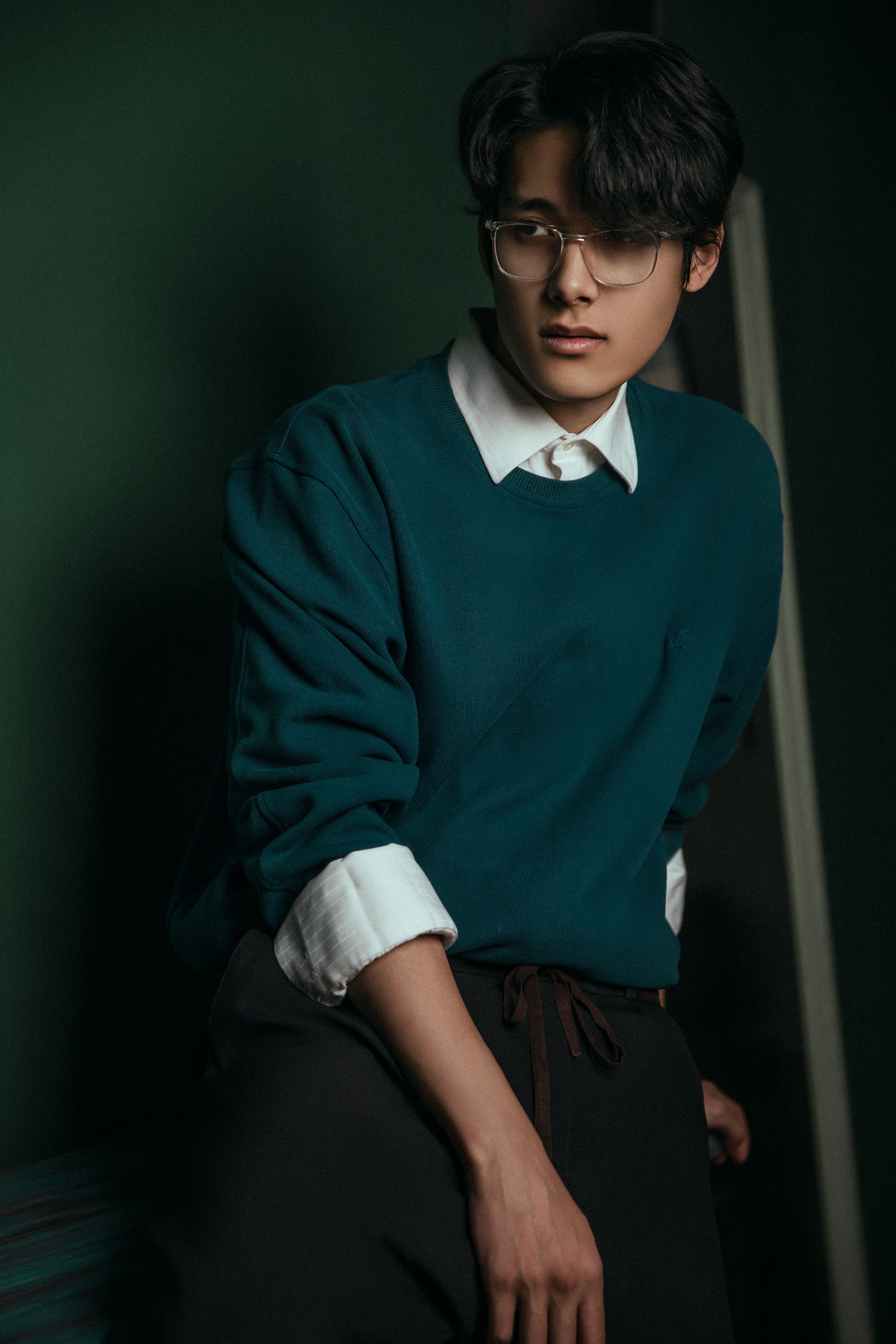 young man with glasses in stylish winter attire