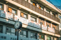 Japanese School Building with Clock and Banners