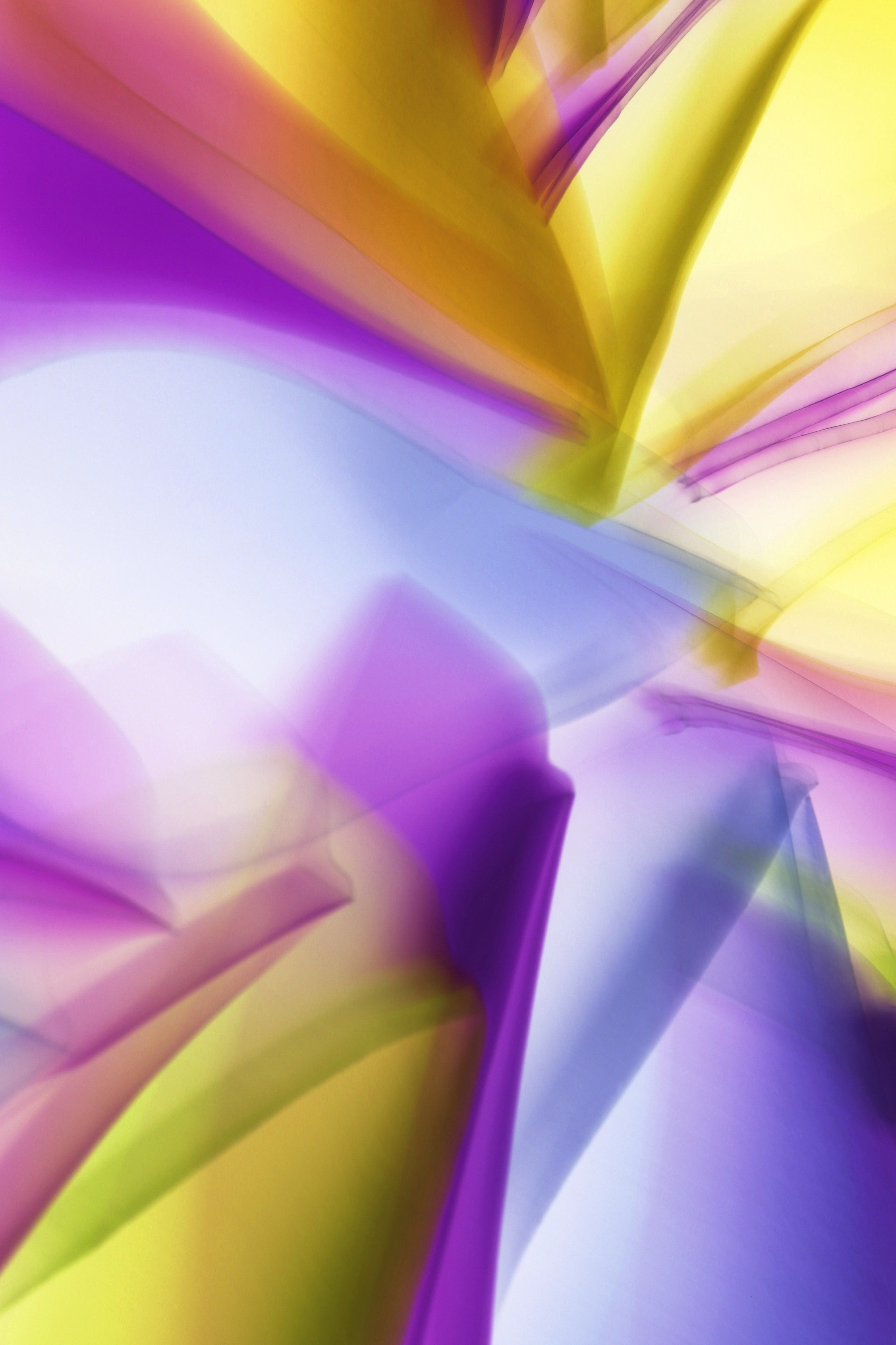 Vibrant abstract image showcasing dynamic light patterns in purple and yellow hues.