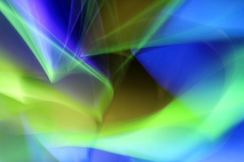 Free Colorful abstract light painting with swirling blue and green hues creating a dynamic visual effect. Stock Photo