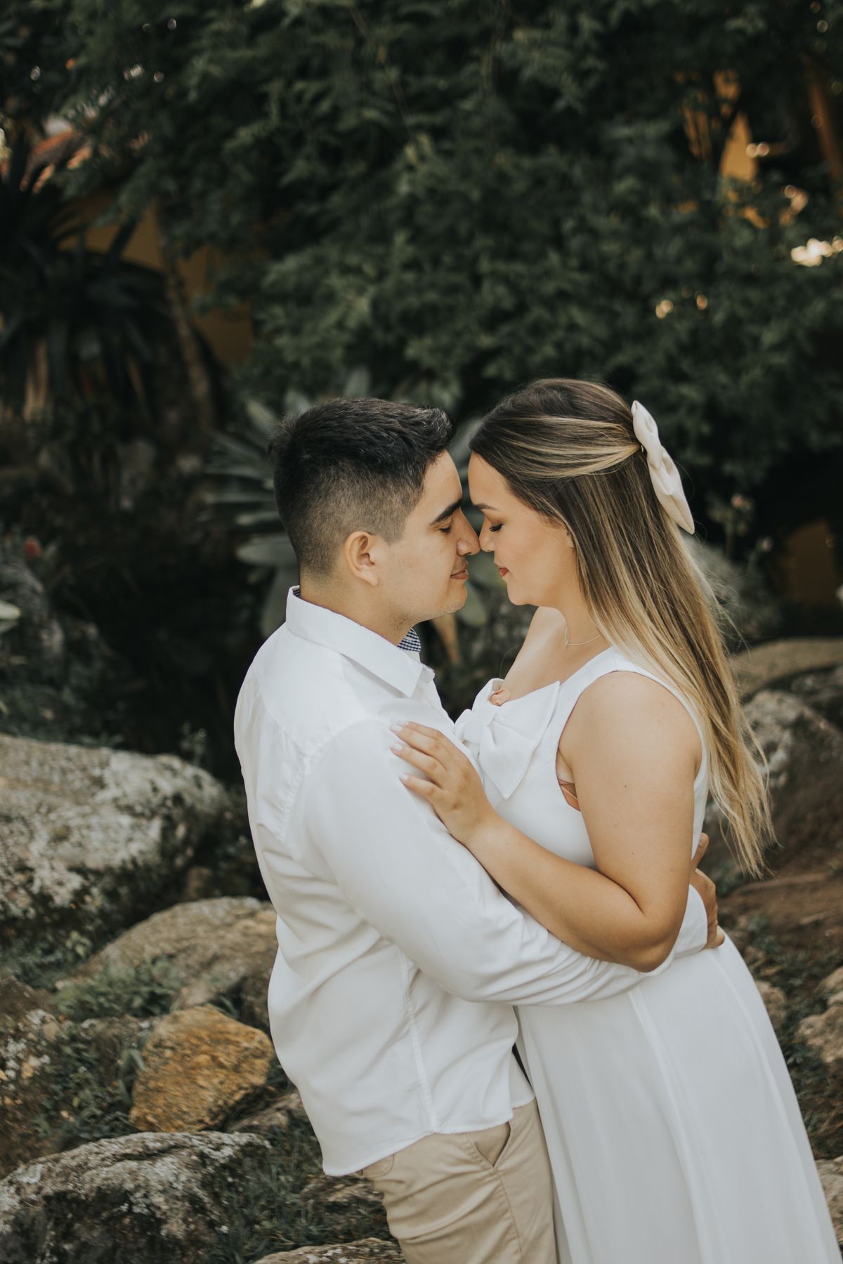 A couple embracing tenderly outdoors in nature