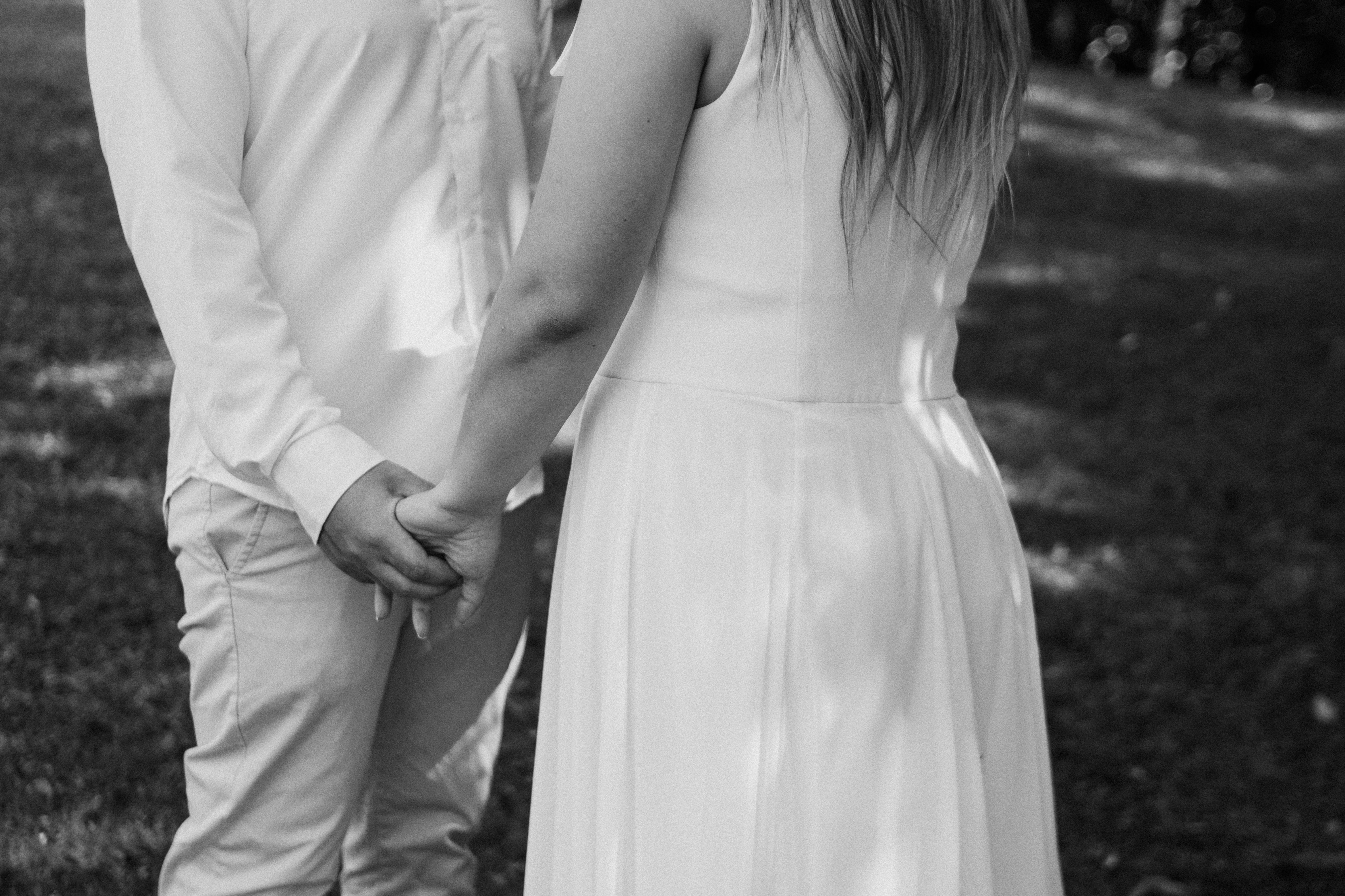 Romantic Couple Holding Hands in Black and White · Free Stock Photo