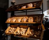 A variety of freshly baked artisan breads on display in a Berlin bakery.