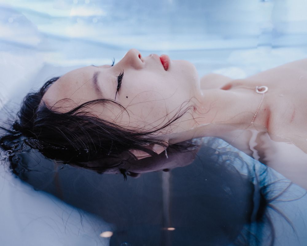 Woman floating serenely in water