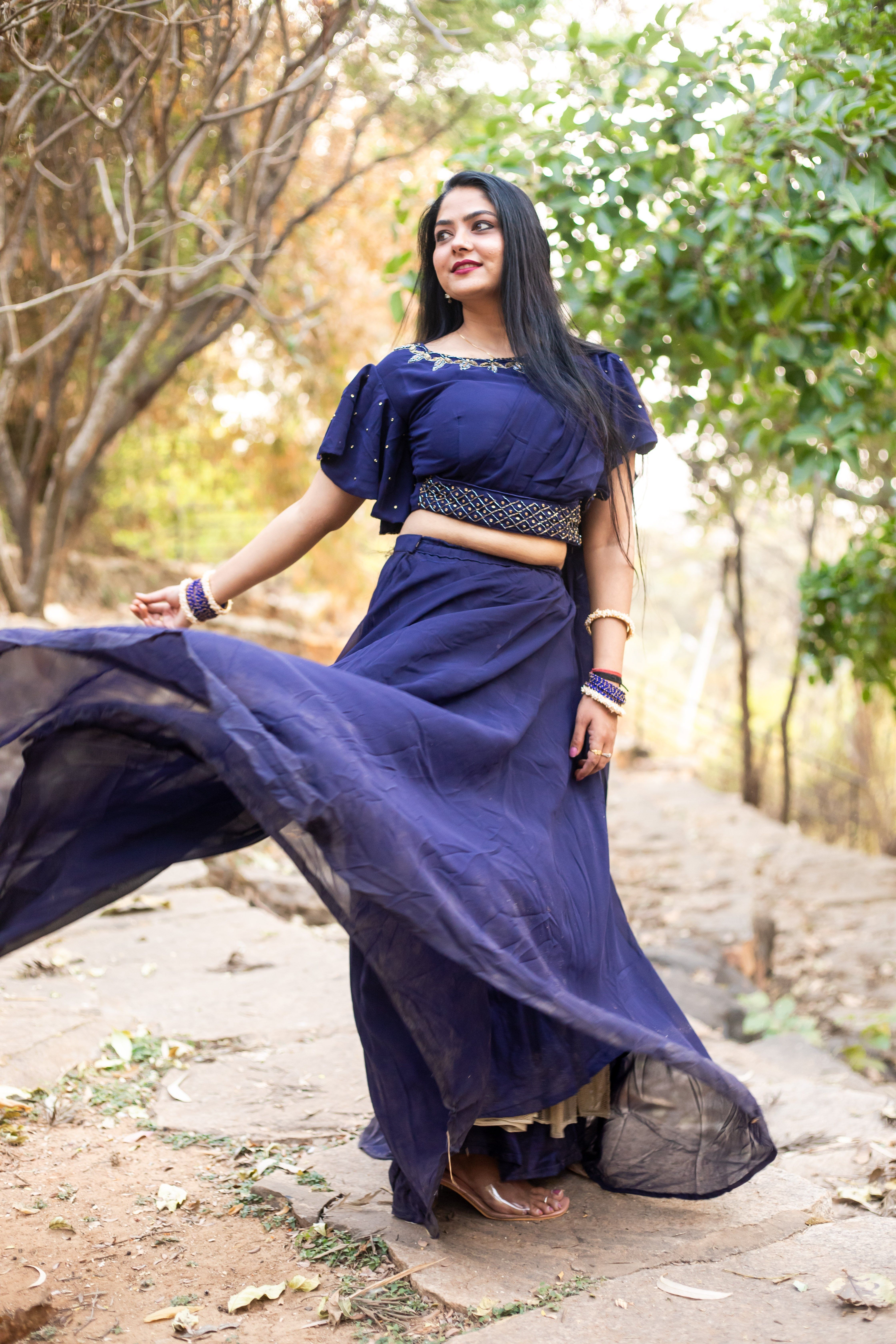 Elegant Woman in Blue Gown Outdoors · Free Stock Photo