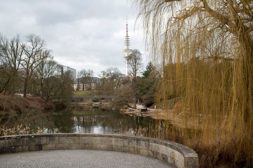 Free Peaceful landscape of Planten un Blomen Park with view of Fernsehturm in Hamburg, Germany. Stock Photo