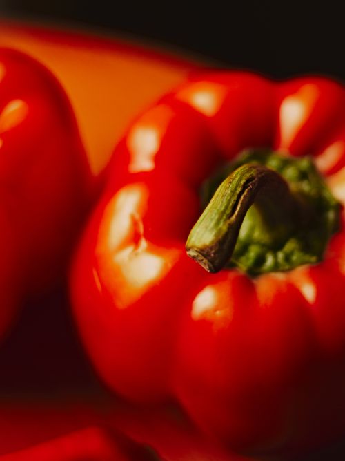 Free Close-up of vibrant red bell peppers, emphasizing their freshness and color. Stock Photo