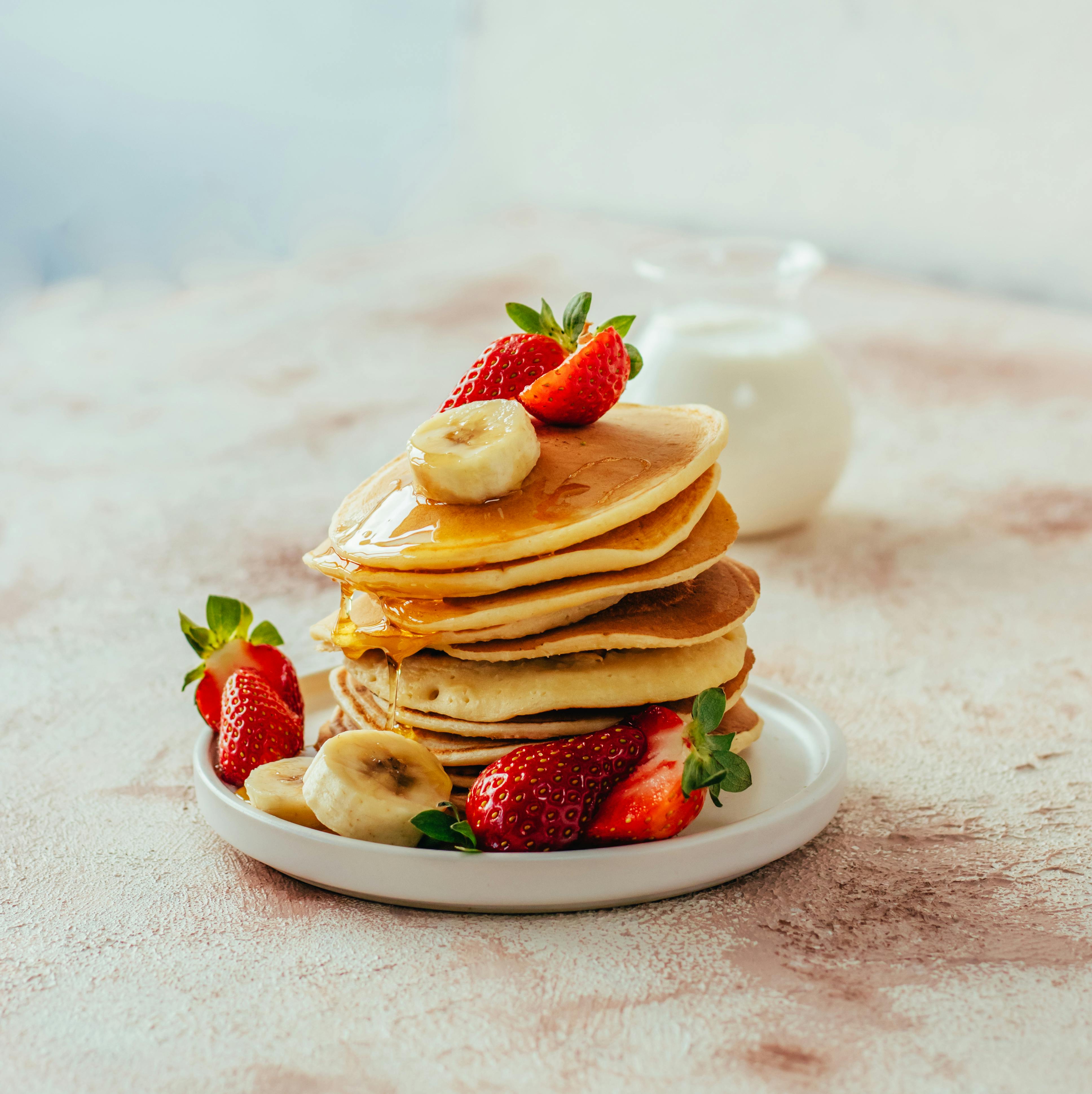 delicious pancakes with strawberries and bananas