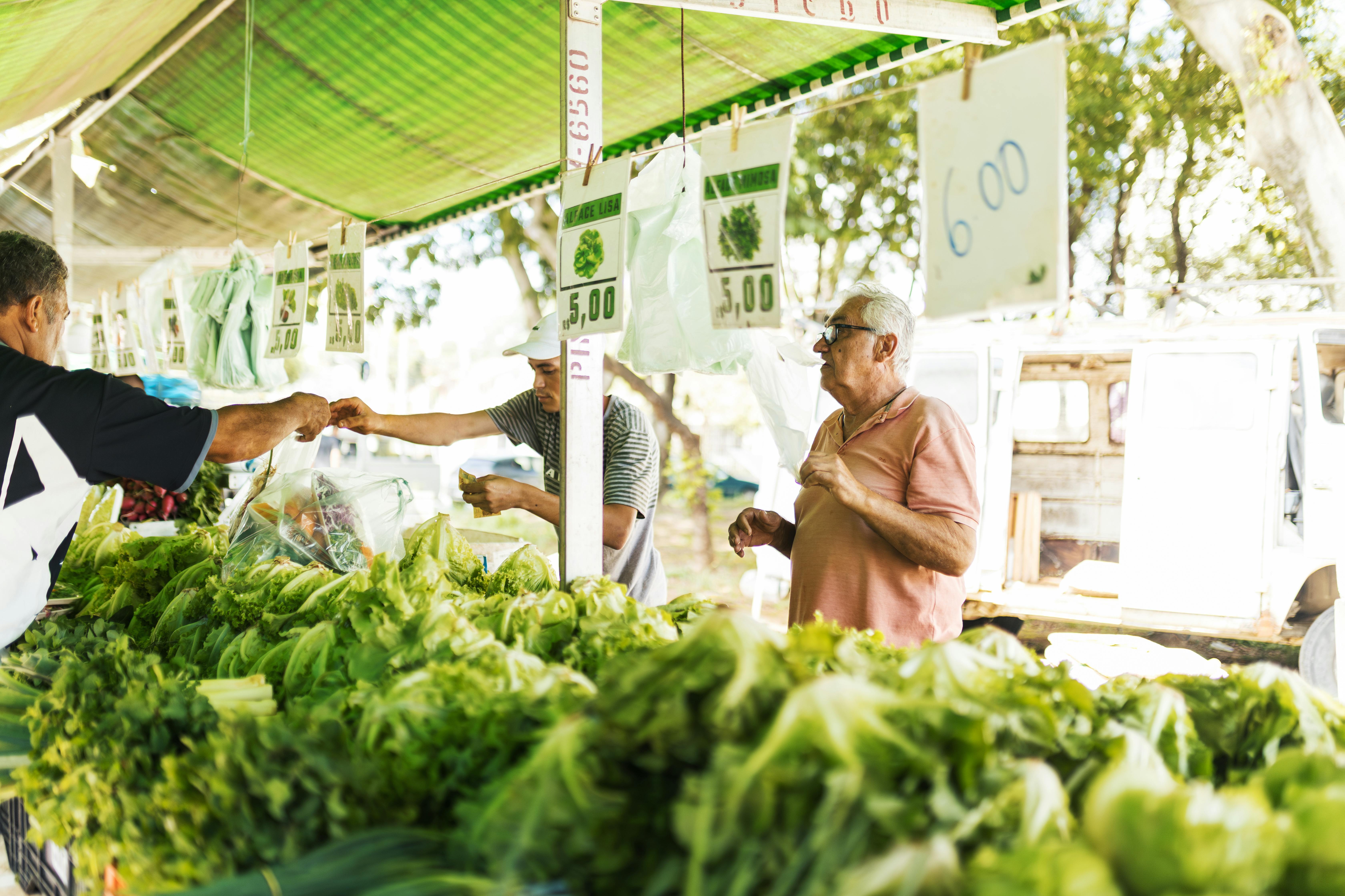 Farmers Market With Fresh Produce And Vendors At Sunset