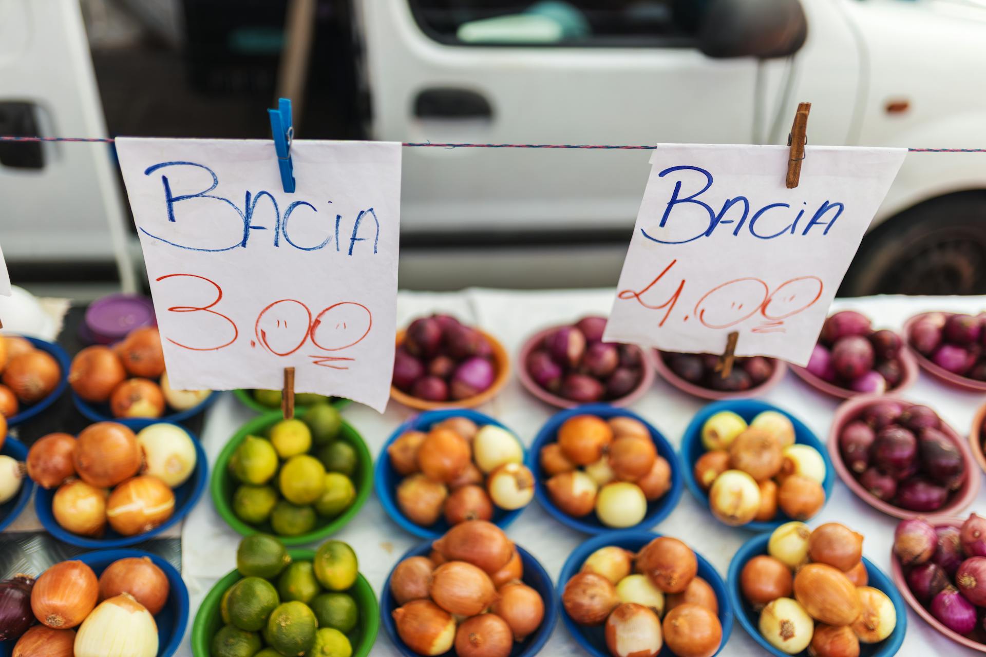 Colorful assortment of fruits and vegetables on display at a vibrant market stall.
