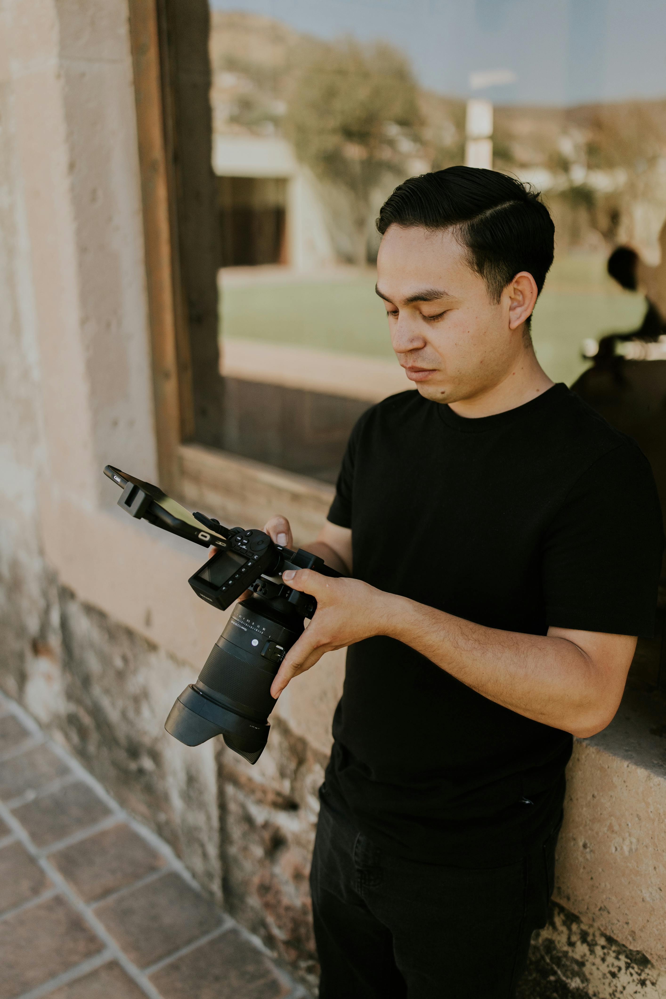 young photographer with camera outdoors