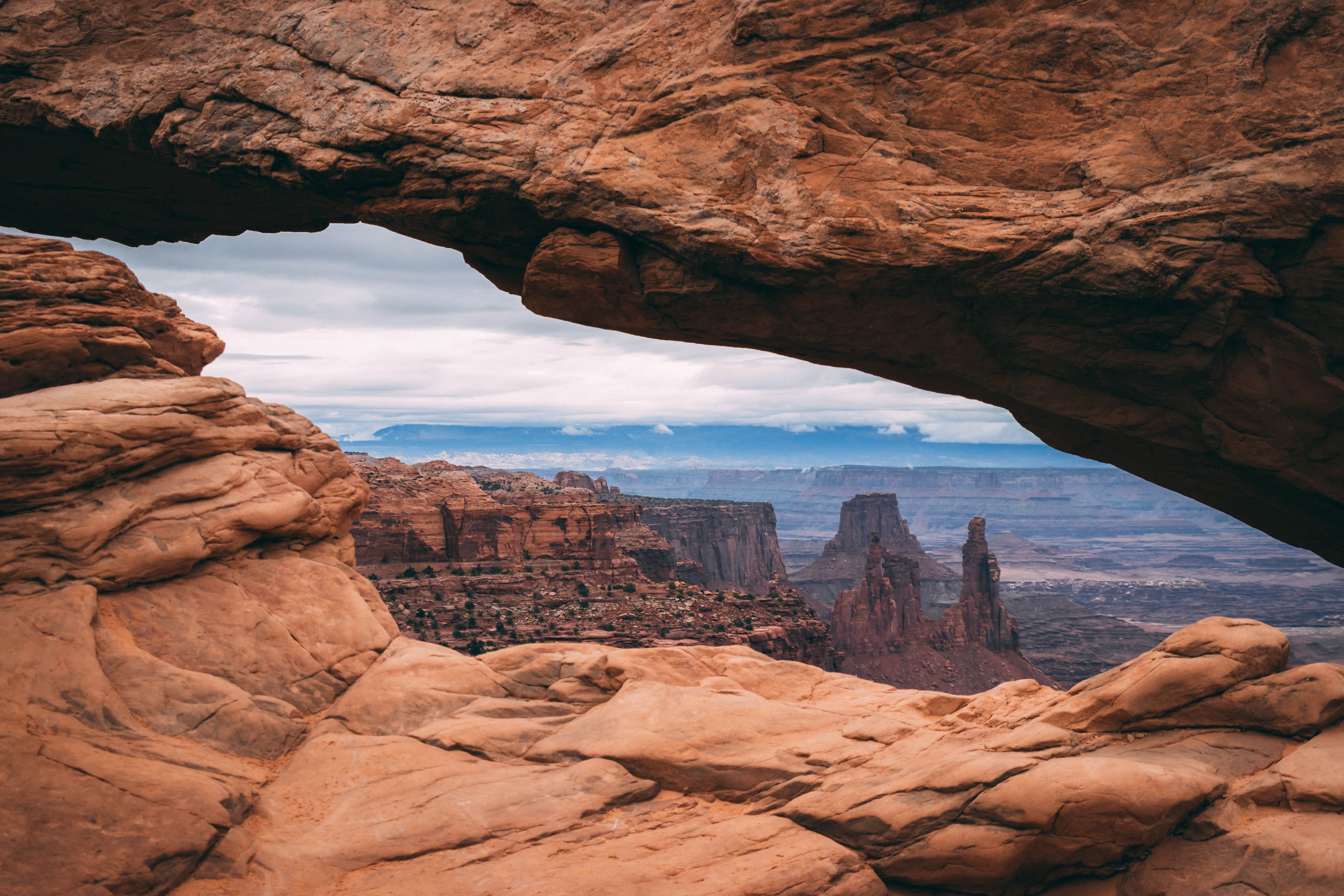 Stunning view through Mesa Arch showcasing the rugged Canyonlands landscape.