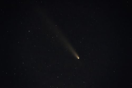 Free A mesmerizing view of a comet streaking across a star-filled night sky in Hüllhorst, Germany. Stock Photo