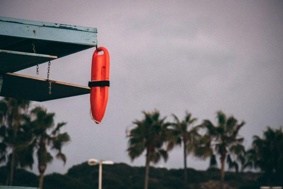 lifeguard with rescue buoy