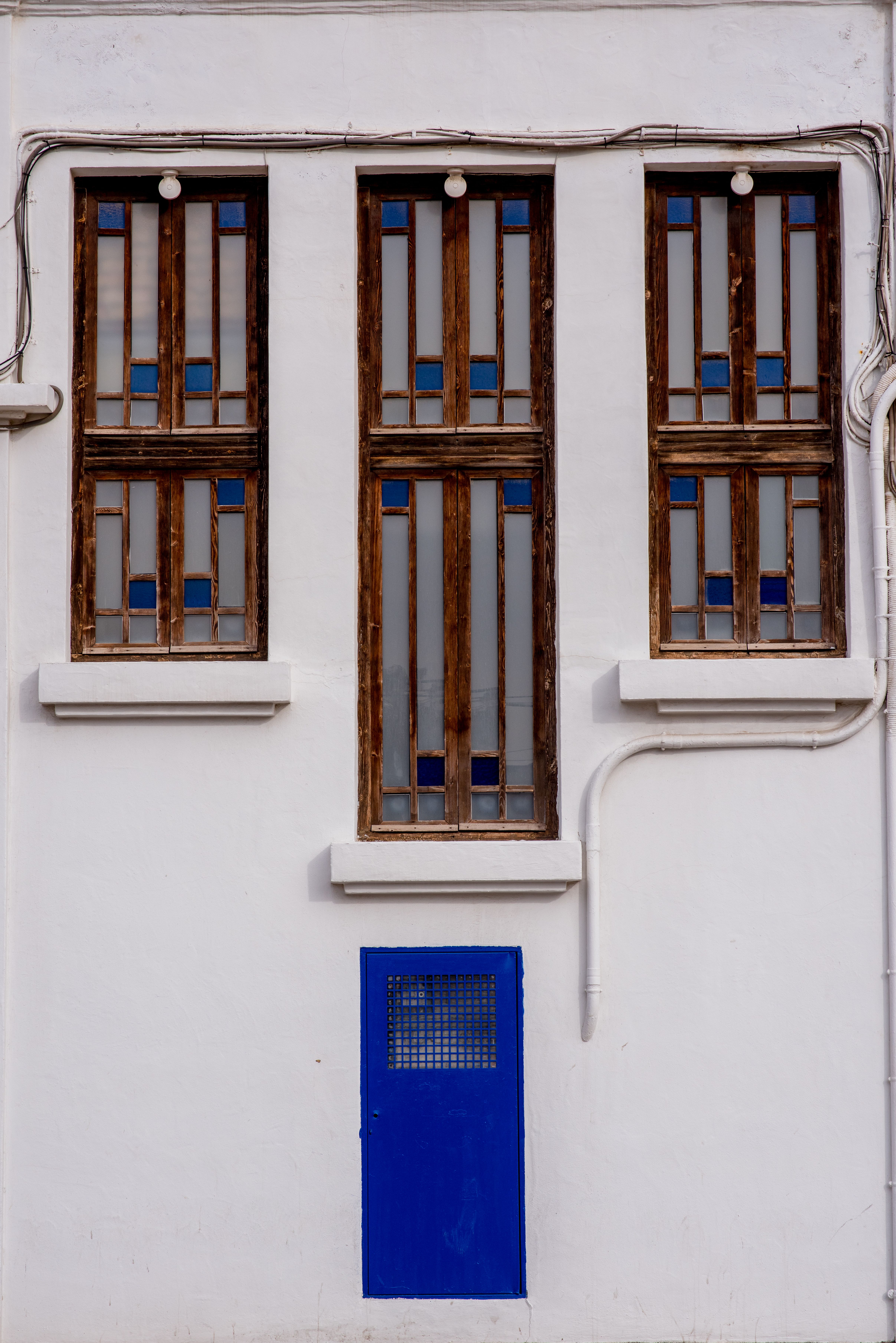 Unique Architectural Facade with Blue Door · Free Stock Photo