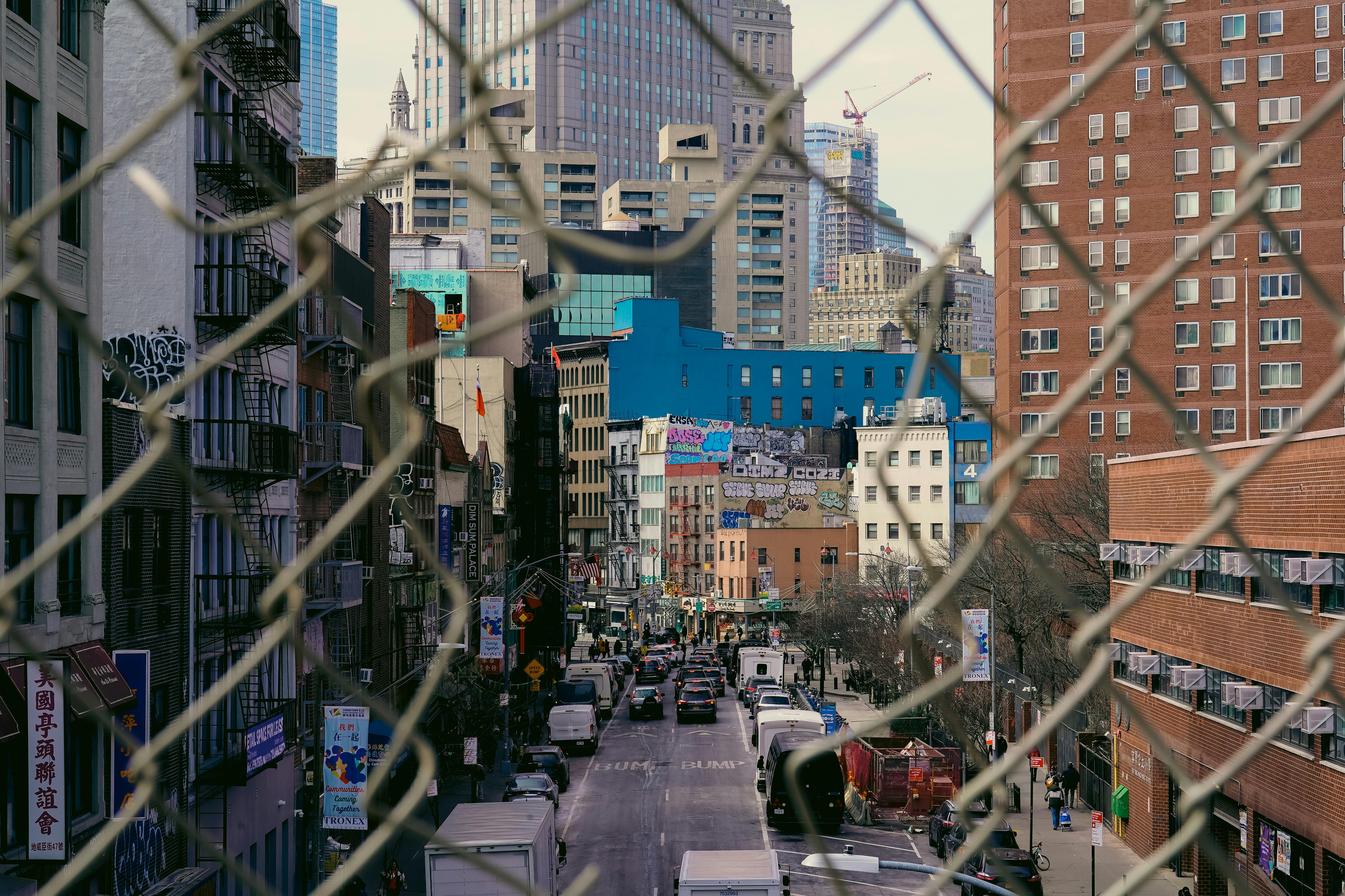 A bustling street scene in Chinatown, New York City, showcasing urban architecture and vibrant culture.