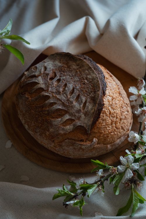 Rustic Bread Design Rustic Sourdough Bread with Floral Decoration · Free Stock Photo