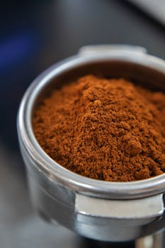 Close-up of finely ground coffee in a portafilter, ready for espresso brewing.