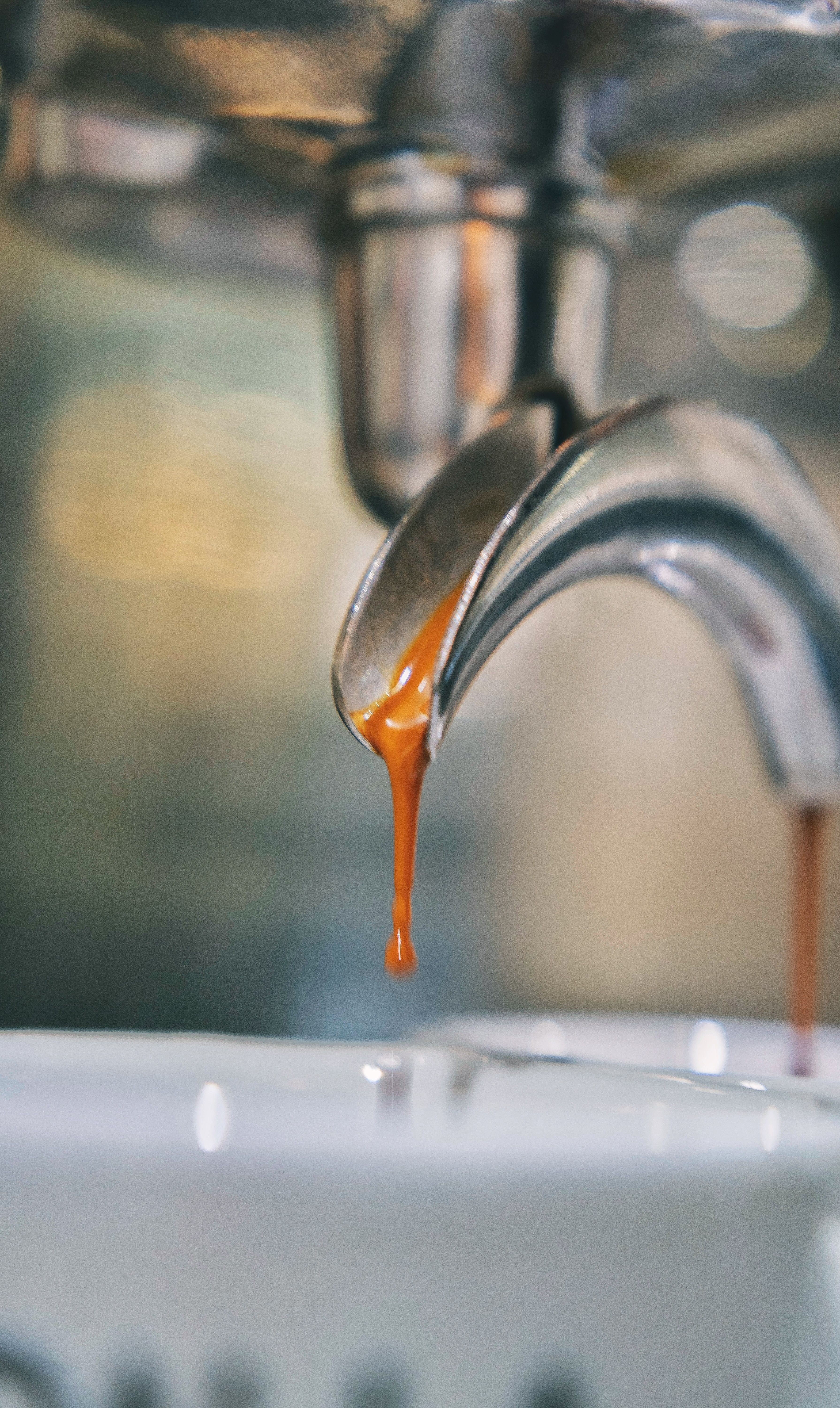 Close-up of Espresso Dripping into Cup · Free Stock Photo