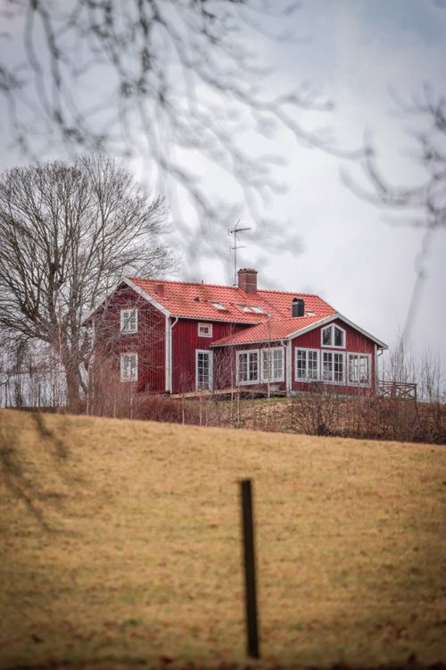 Free Charming red house in rural Jönköping, Sweden surrounded by nature. Stock Photo
