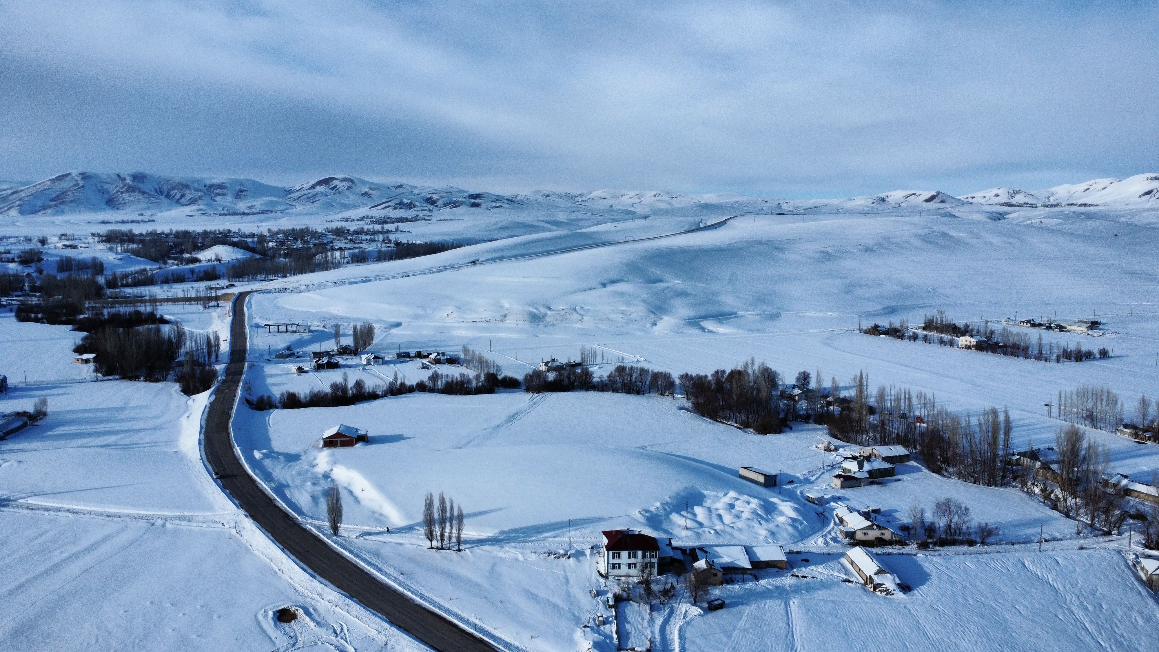 Aerial View of Snow-Covered Rural Landscape · Free Stock Photo