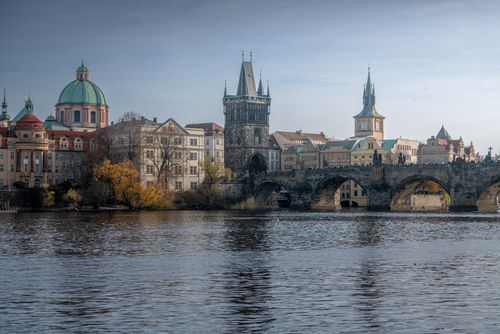 Free Beautiful view of Charles Bridge and historic Prague architecture against a serene river backdrop. Stock Photo