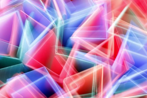 Free Vibrant abstract artwork featuring colorful geometric shapes and light streaks. Stock Photo