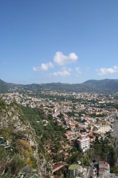 Discover a stunning aerial view of a Turkish city surrounded by lush hills.