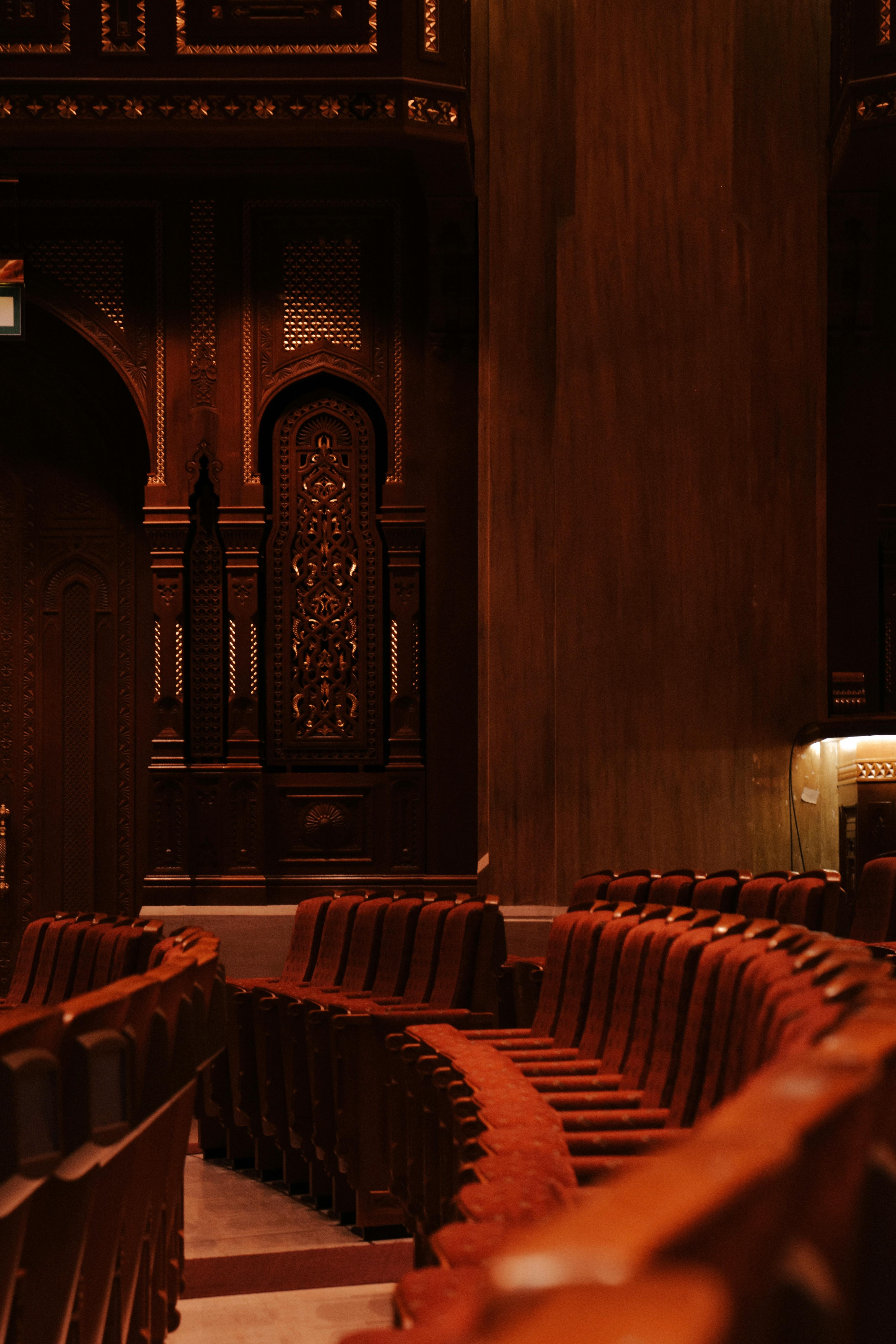 Free Luxurious empty theater with ornate wooden details in Muscat, Oman. Stock Photo