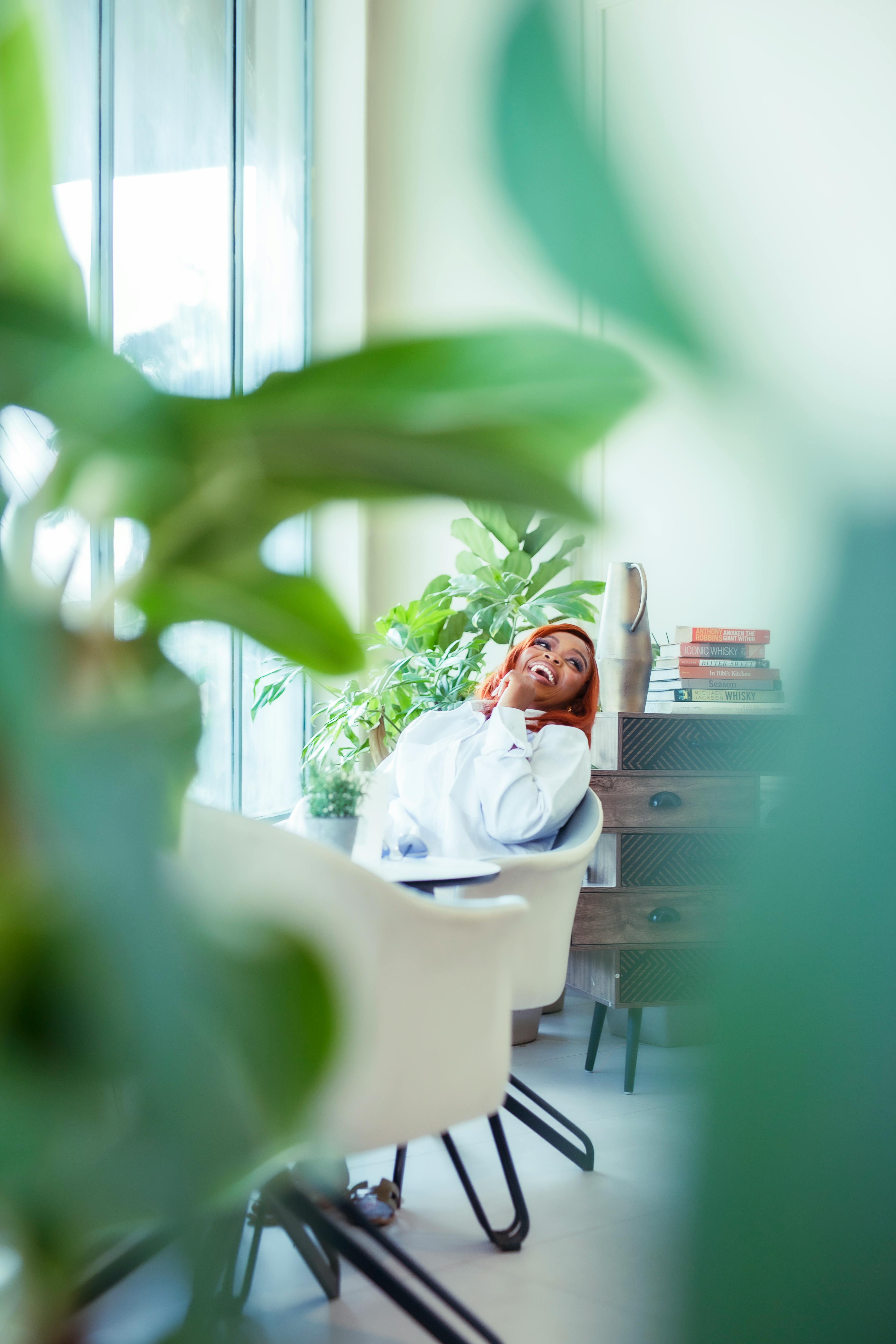 relaxed woman in modern indoor workspace