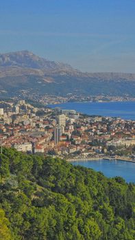 A breathtaking aerial view of Split, Croatia, showcasing the cityscape and Adriatic Sea on a sunny day.