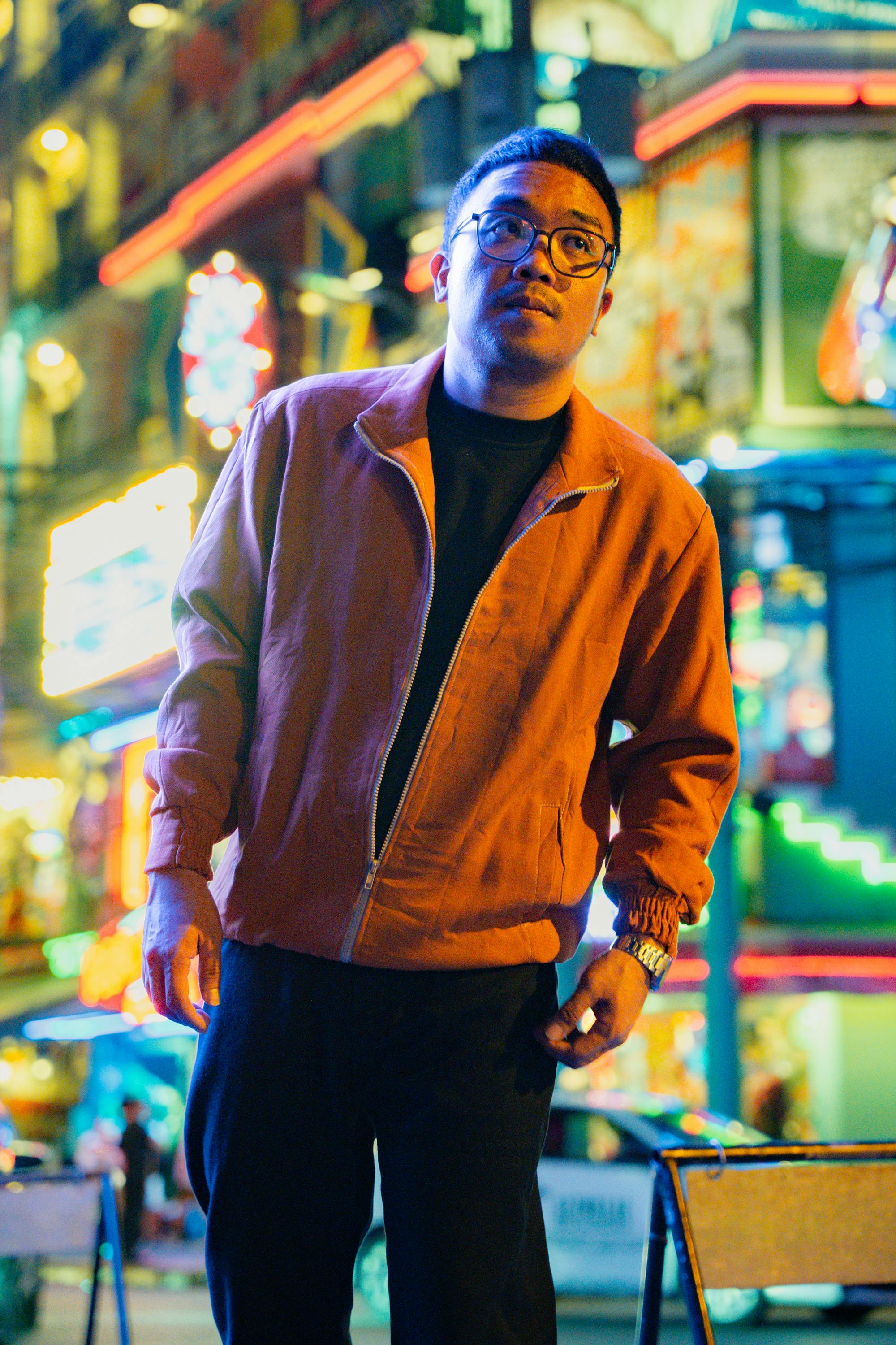 man in urban night scene with neon lights