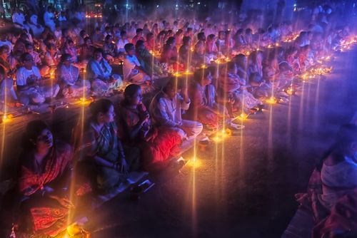 Free A serene scene of people gathered with candles at night, celebrating a traditional event in Kachua, India. Stock Photo