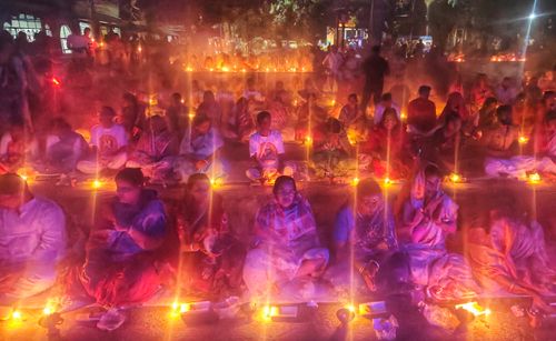 Free A vibrant night scene captures a traditional religious ceremony in Kachua, West Bengal. Stock Photo