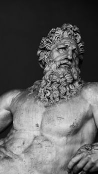 A striking close-up of a detailed marble sculpture in black and white.