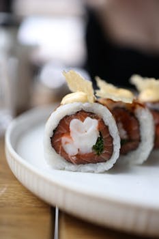 A delectable sushi roll with artistic heart design on a white plate, showcasing premium ingredients.