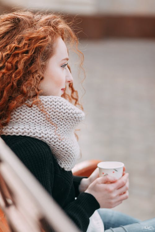 Selective Focus Photography Of Woman Holding Cup Of Coffee