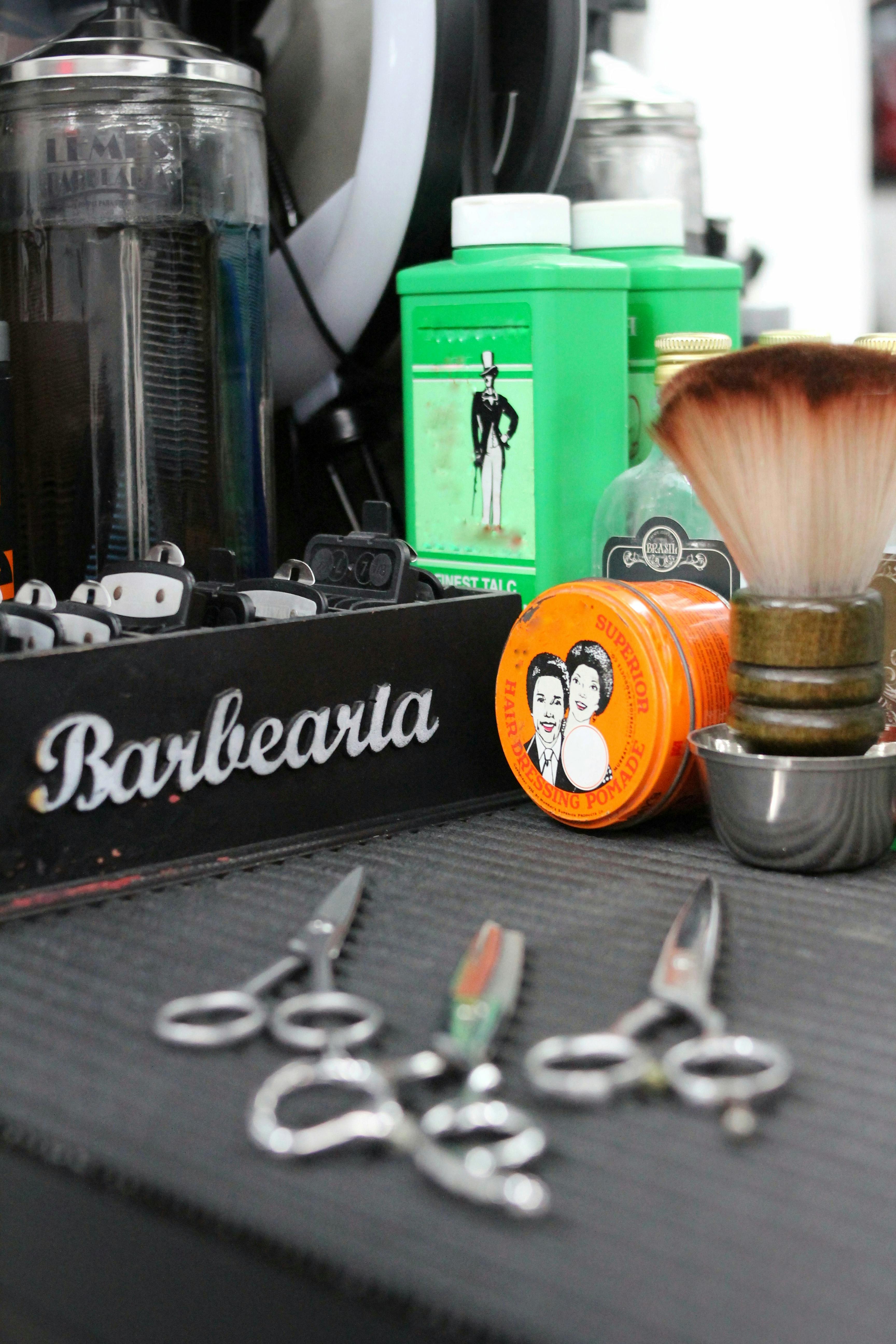 Vintage barber shop tools including clippers, scissors, and grooming products in São Paulo.