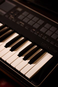 A close-up view of a digital piano keyboard's white and black keys, highlighting its sleek design.