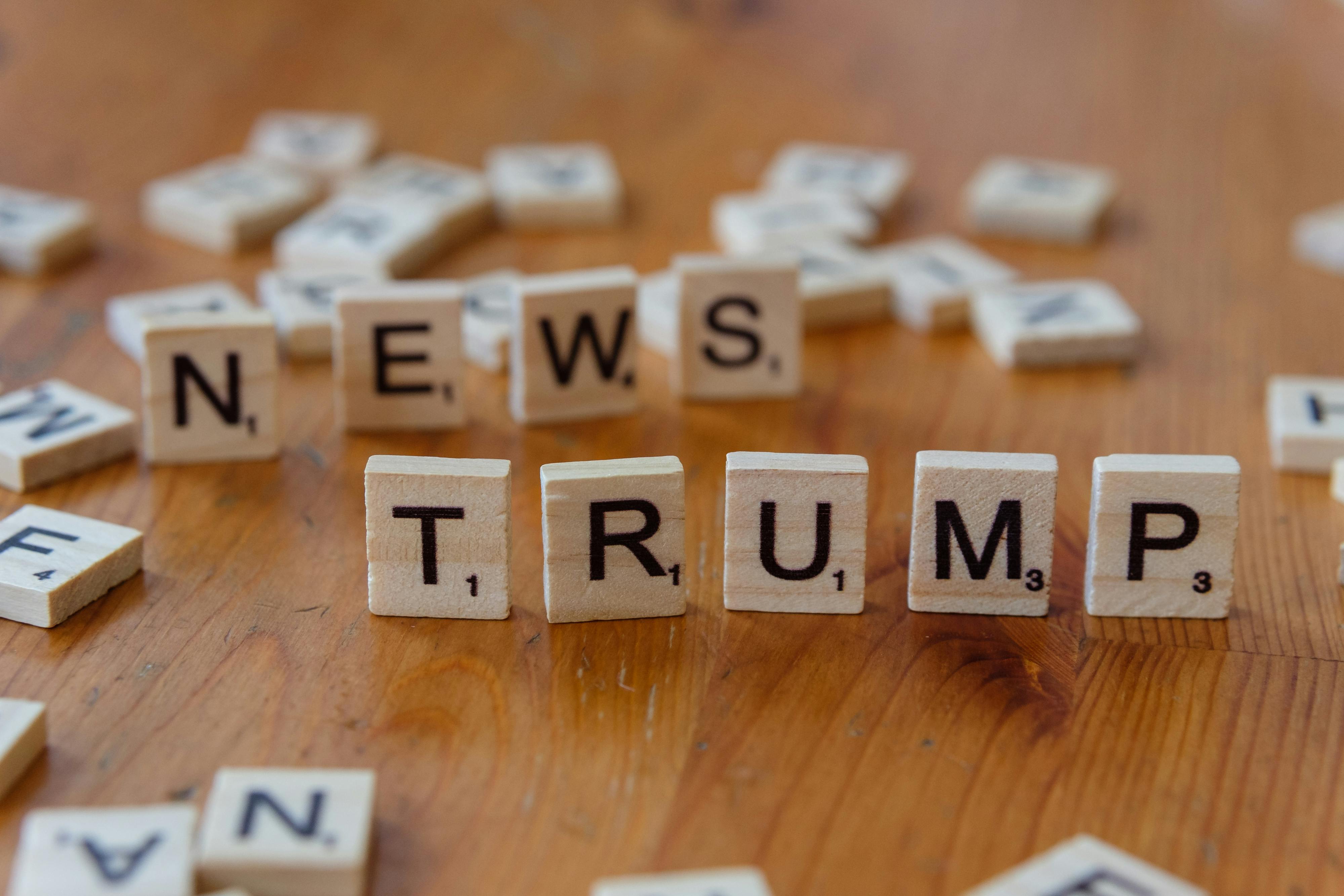 wooden letter tiles spelling news and trump