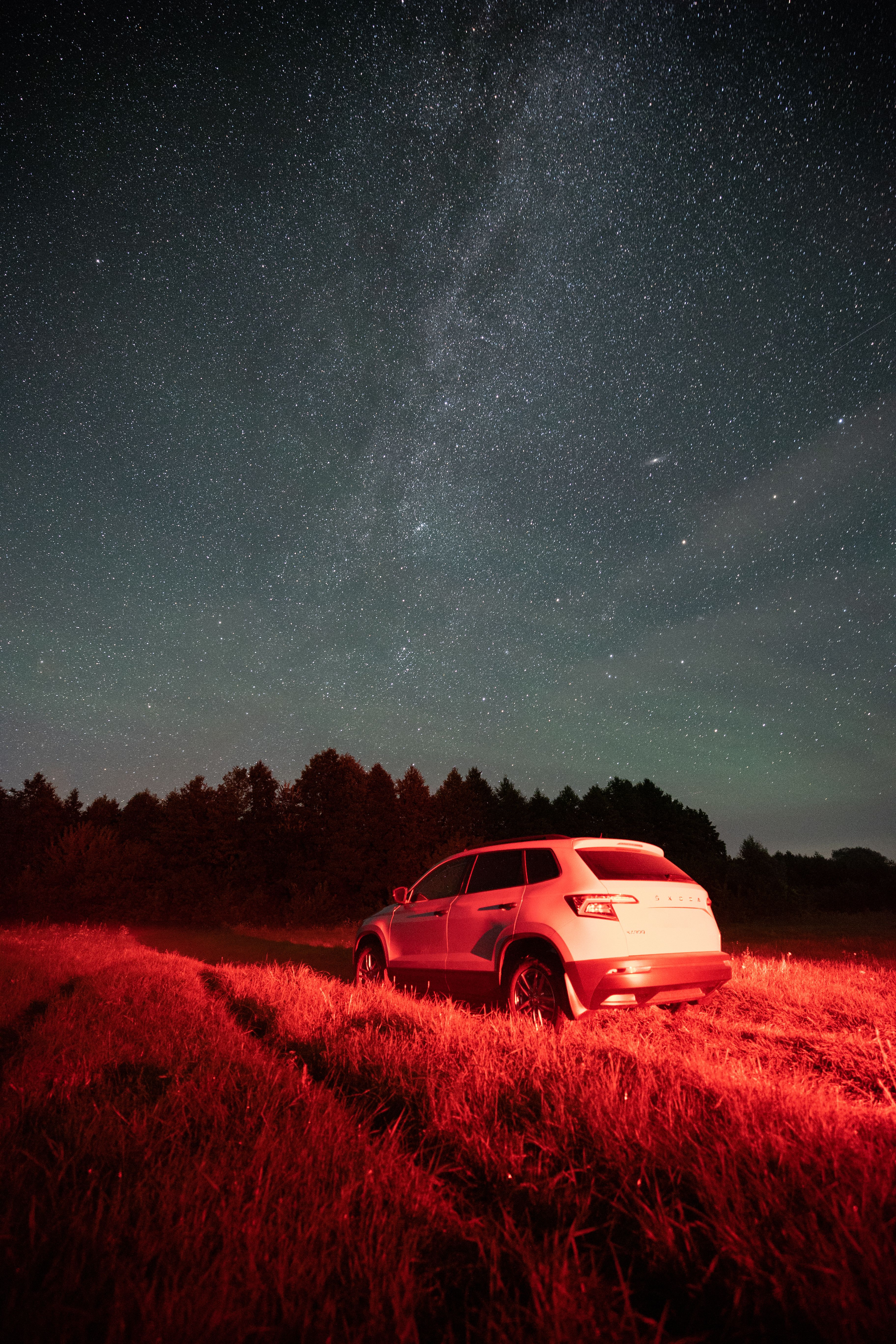 Car under Starry Night Sky with Milky Way · Free Stock Photo