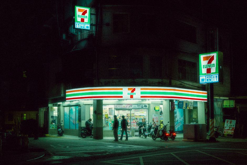 A 7-Eleven store in Thailand displaying local SIM cards for purchase
