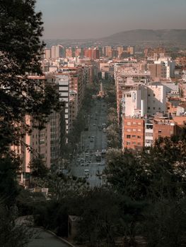 Stunning view of Alicante's vibrant urban landscape during golden hour with bustling traffic.